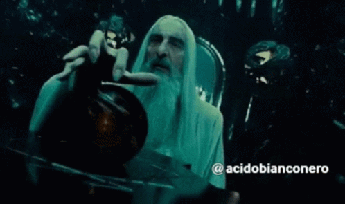 A Man With Long White Hair And A Beard Is Holding Something In His Hand With The Hashtag Acidobianconero On The Bottom GIF