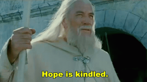 A Man With Long White Hair And A Beard Says Hope Is Kindled In Yellow Letters GIF