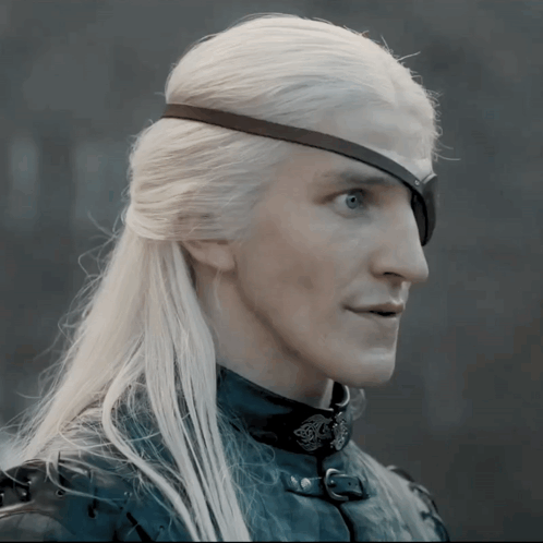 A Man With Long White Hair Has A Black Eye Patch GIF
