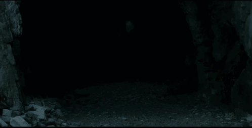 A Man With Long White Hair Is Holding A Sword In His Hand . GIF