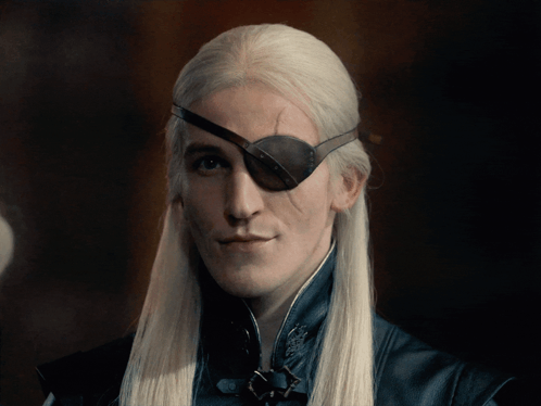 A Man With Long White Hair Wearing A Black Eye Patch GIF