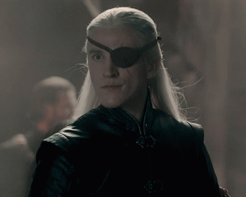 A Man With Long White Hair Wears A Black Eye Patch GIF