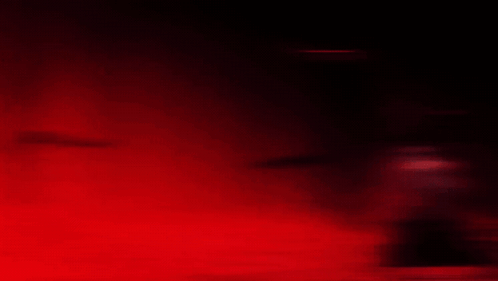 A Man With Many Eyes Is Holding A Sword In His Right Hand GIF