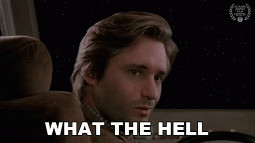 Man With Missing Teeth Sitting In Car Behind What The Hell GIF