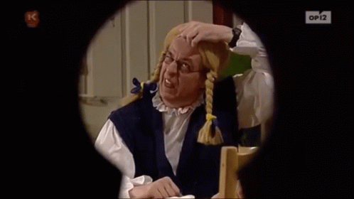 a man with pigtails and glasses is looking through a keyhole with op12 on the bottom right