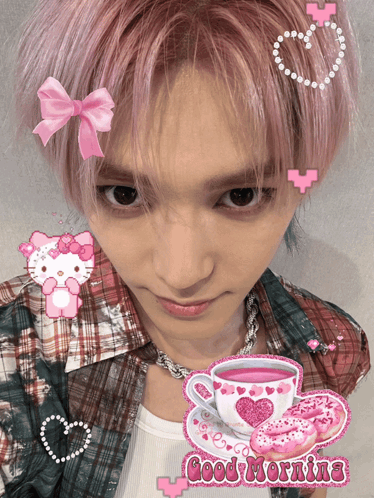 A Man With Pink Hair Has A Hello Kitty Sticker On His Head And A Cup Of Tea GIF