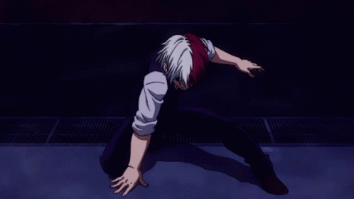 A Man With Red And White Hair Is Laying On The Ground GIF