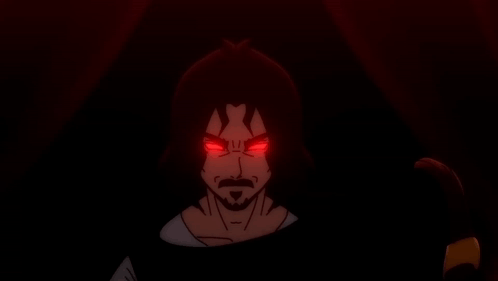 A Man With Red Eyes And A Beard Looks Angry GIF