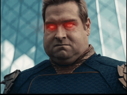 a man with red eyes and a blue shirt