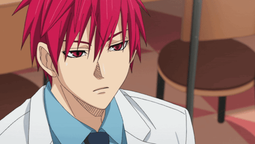 A Man With Red Hair And A White Coat And Tie GIF