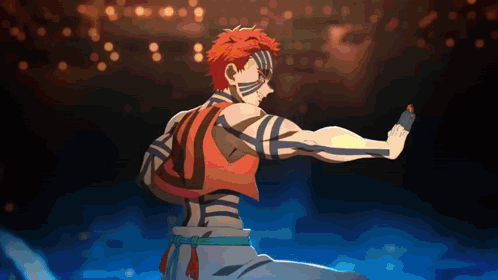 a man with red hair and blue stripes on his body is standing in the dark
