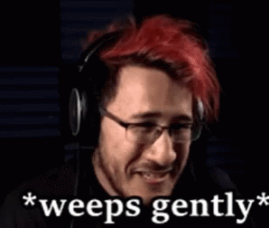 A Man With Red Hair And Glasses Is Wearing Headphones And Says `` Weeps Gently '' GIF