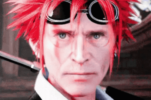 A Man With Red Hair And Goggles Looks At The Camera . GIF