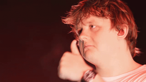 A Man With Red Hair Giving A Thumbs Up Sign GIF