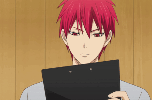 A Man With Red Hair Holds A Clipboard In His Hand GIF