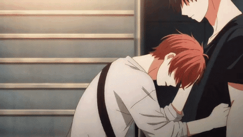 A Man With Red Hair Is Hugging Another Man 'S Arm GIF