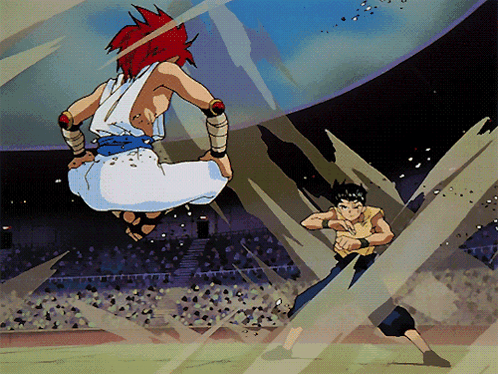 A Man With Red Hair Is Jumping In The Air While Another Man In A Yellow Shirt Stands Behind Him GIF