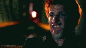 Red Haired Man Making Funny Face With Flashlight GIF