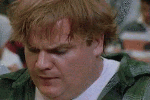 A Man With Red Hair Is Sitting At A Table In A Restaurant . GIF