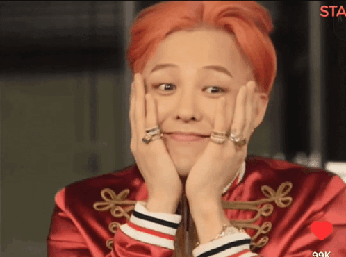 A Man With Red Hair Is Smiling With His Hands On His Face GIF