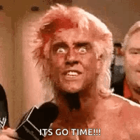 A Man With Red Hair Is Talking Into A Microphone And Making A Funny Face . GIF