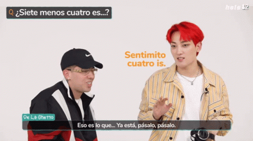 A Man With Red Hair Is Talking To Another Man With Glasses GIF