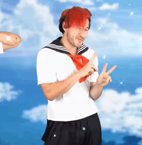 A Man With Red Hair Is Wearing A Sailor Suit And A Red Tie . GIF