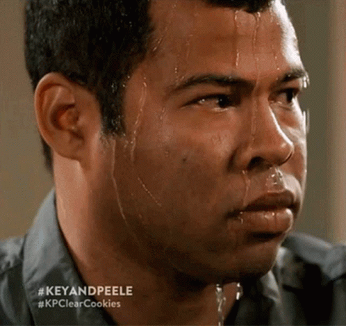 A Man With Sweat Coming Out Of His Face And The Words Key And Peele GIF