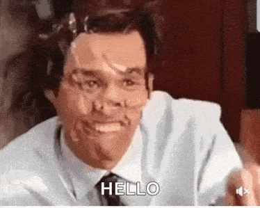 A Man With Tape On His Face Is Saying Hello . GIF