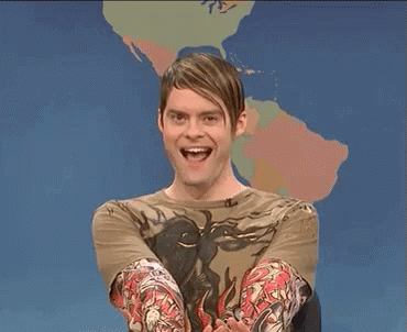 A Man With Tattoos On His Arms Is Smiling And Saying Yes GIF