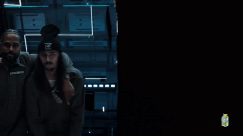 A Man With The Name Black On His Shirt Is Being Held GIF