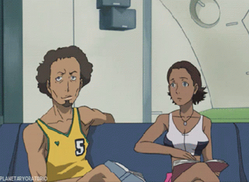 A Man With The Number 5 On His Jersey Sits Next To A Woman On A Couch GIF