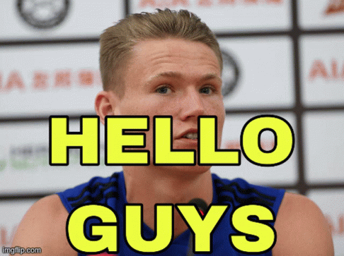 A Man With The Words Hello Guys Behind Him GIF
