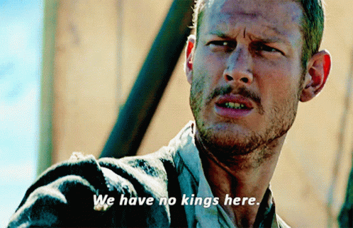 A Man With The Words We Have No Kings Here Written On His Face GIF