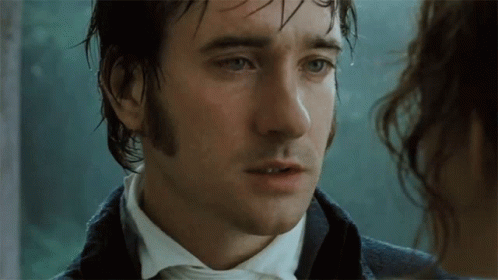 A Man With Wet Hair Looks At A Woman GIF