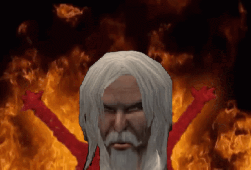 A Man With White Hair And A Beard Is In Front Of A Fire Background GIF