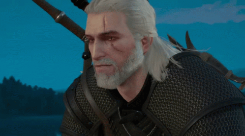 a man with white hair and a beard is wearing a black jacket