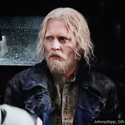 A Man With White Hair And A Beard Is Wearing A Leather Jacket GIF
