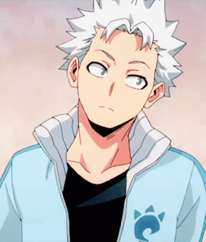 A Man With White Hair Is Wearing A Jacket With A Cat On It GIF