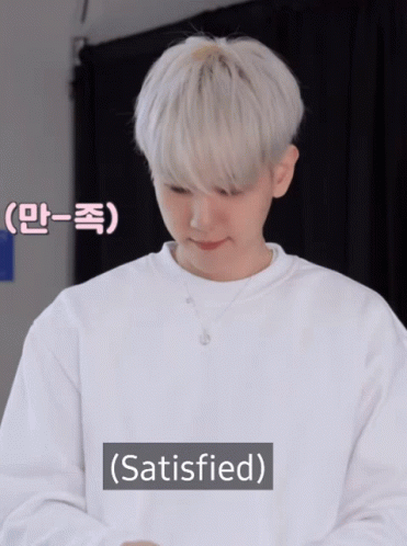 A Man With White Hair Is Wearing A White Sweater And The Word Satisfied Is Above Him GIF