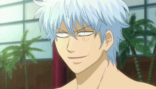 A Man With White Hair Making A Funny Face With His Eyes Closed GIF