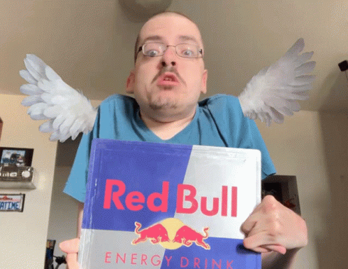 A Man With Wings Holds A Can Of Red Bull Energy Drink GIF
