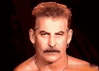 Man Without Shirt With Mustache And Earrings GIF