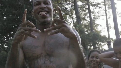 A Man Without A Shirt Has A Tattoo On His Chest That Says ' I Love You ' GIF