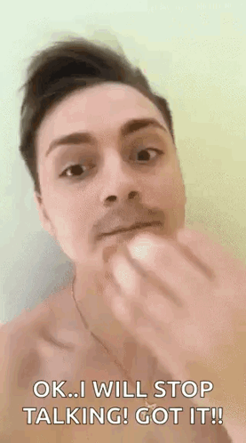 A Man Without A Shirt Is Eating A Banana And Says `` Ok I Will Stop Talking ! Got It ! '' GIF