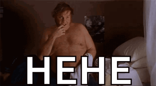A Man Without A Shirt Is Sitting On A Bed With The Word " Hehe " Written On The Bottom GIF