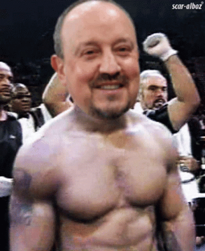 A Man Without A Shirt Is Smiling With Scar-Alboz Written In The Corner GIF