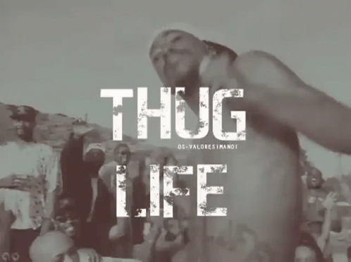 A Man Without A Shirt Is Standing In Front Of A Crowd With The Words Thug Life Above Him GIF
