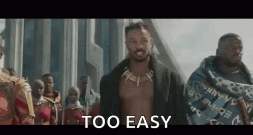 A Man Without A Shirt Is Standing In Front Of A Group Of People And Says `` Too Easy '' . GIF