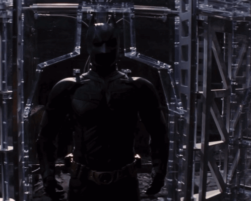 A Man Without A Shirt Is Standing In Front Of A Mirror Looking At Himself GIF